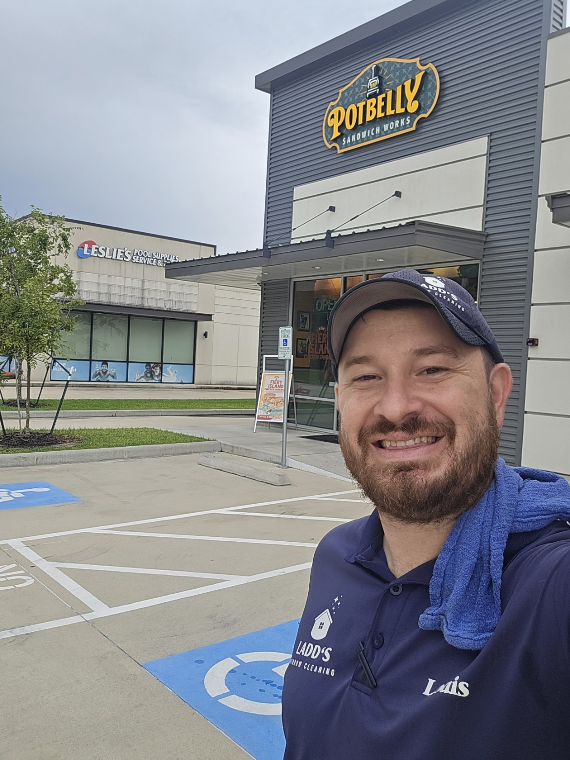 Ladd's Window Cleaning owner on a commercial service route